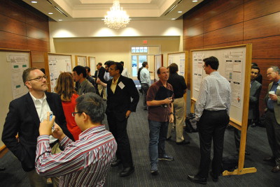 Students present posters to the other attendees