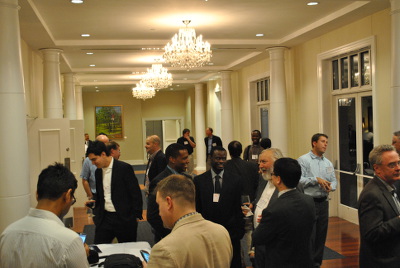 Conference attendees enjoy a social event after a productive day of talks and poster presentations